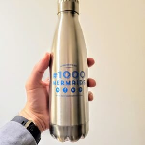 A shiny 16oz metal water bottle with the 1000 mermaids project logo on it